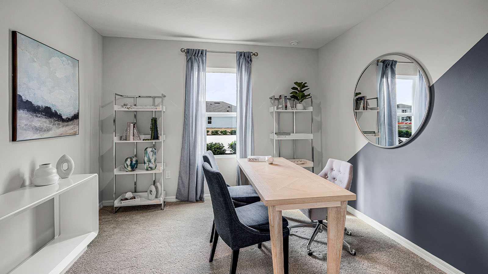guest bedroom decorated into an office space
