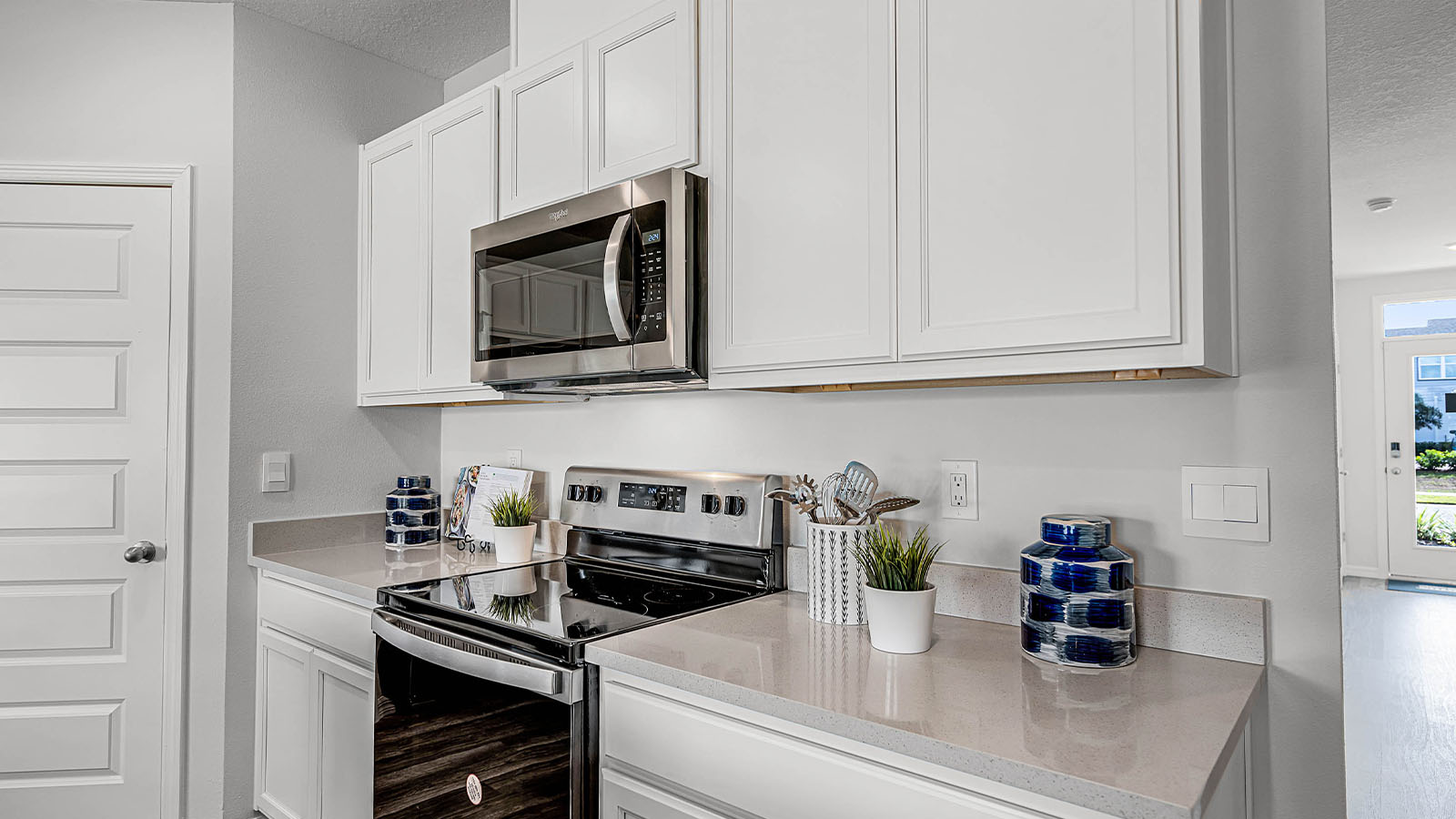 Kitchen with quartz countertops and stainless steel appliances