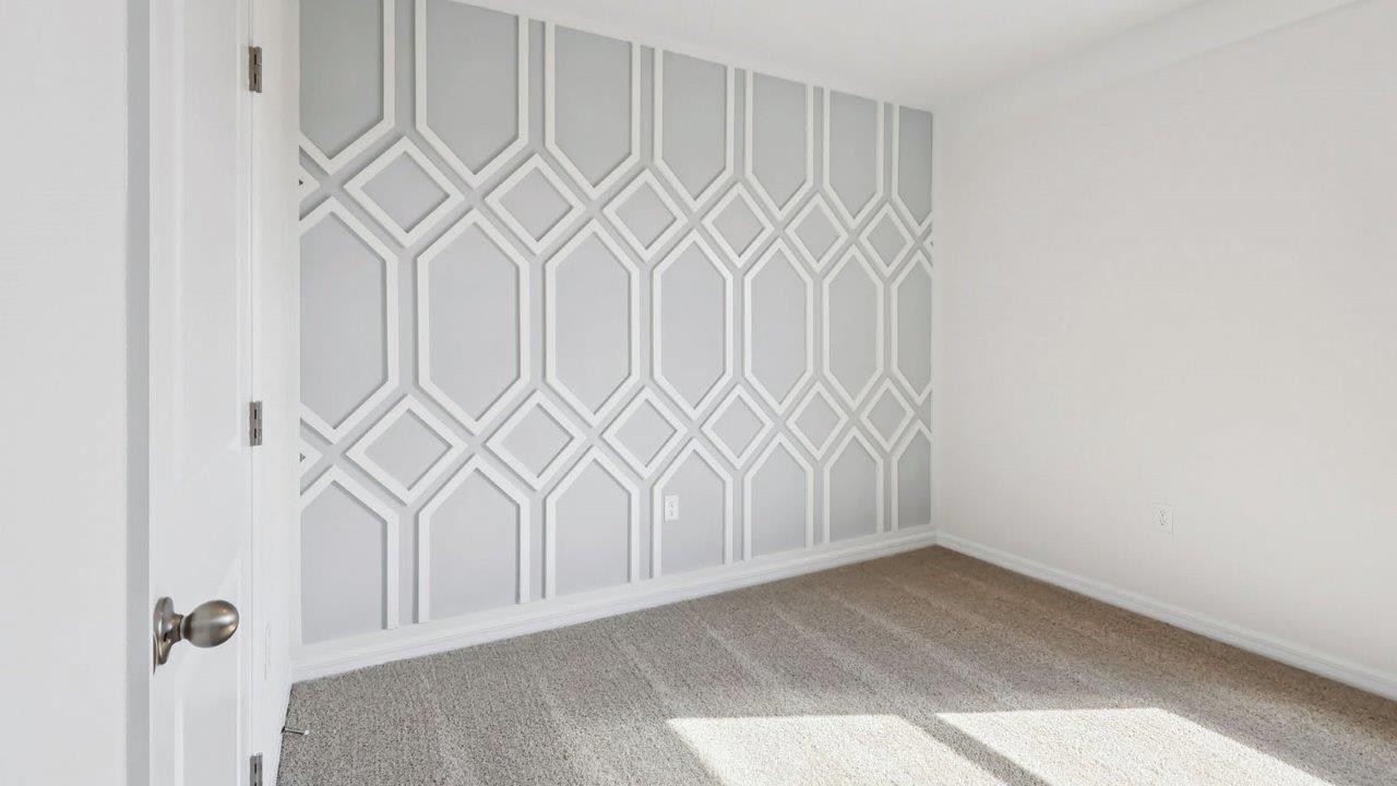 Guest bedroom with wall accents