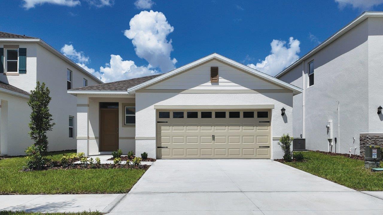 Exterior single family home with two car garage