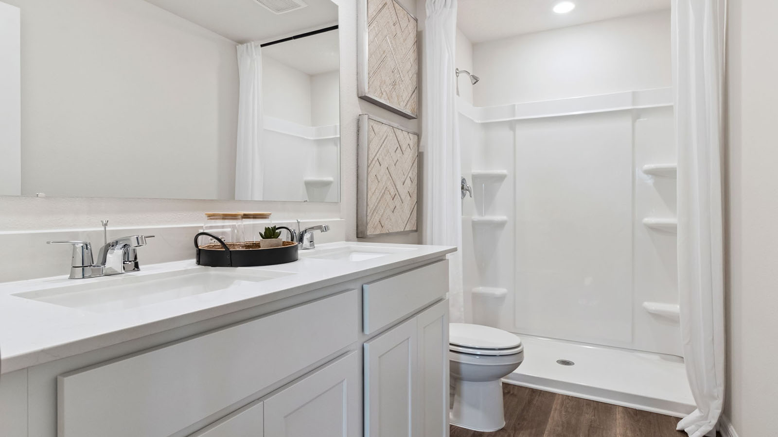 Primary bathroom with walk in shower and luxury vinyl flooring