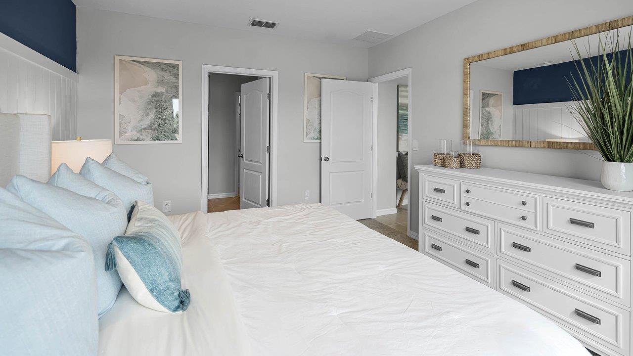 Primary bedroom with view of the bathroom