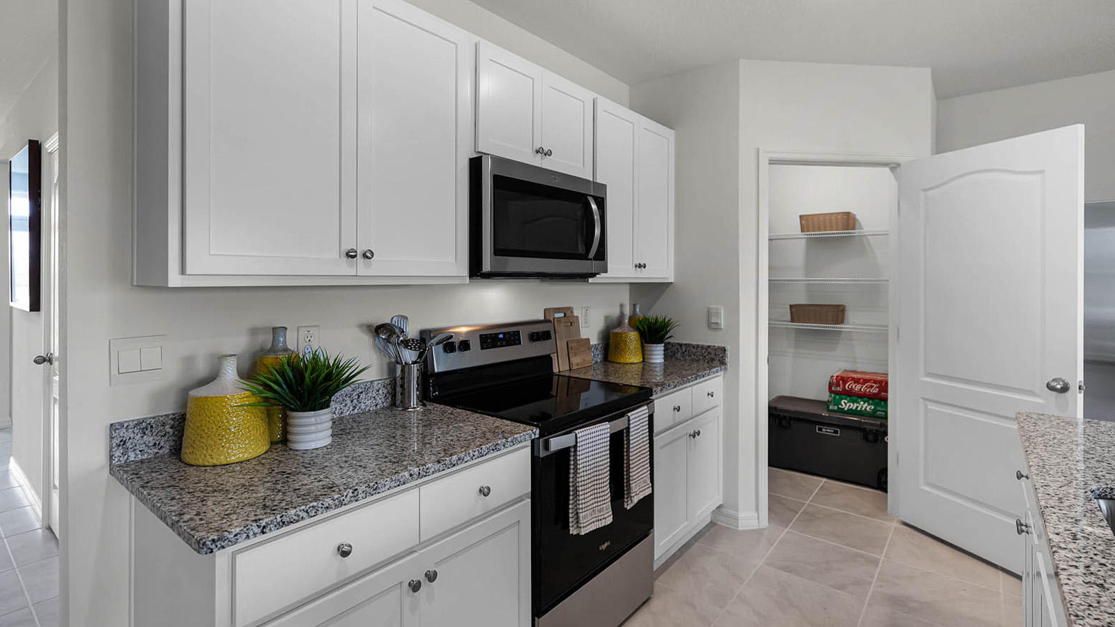 Kitchen with white cabinets and stainless steel appliances