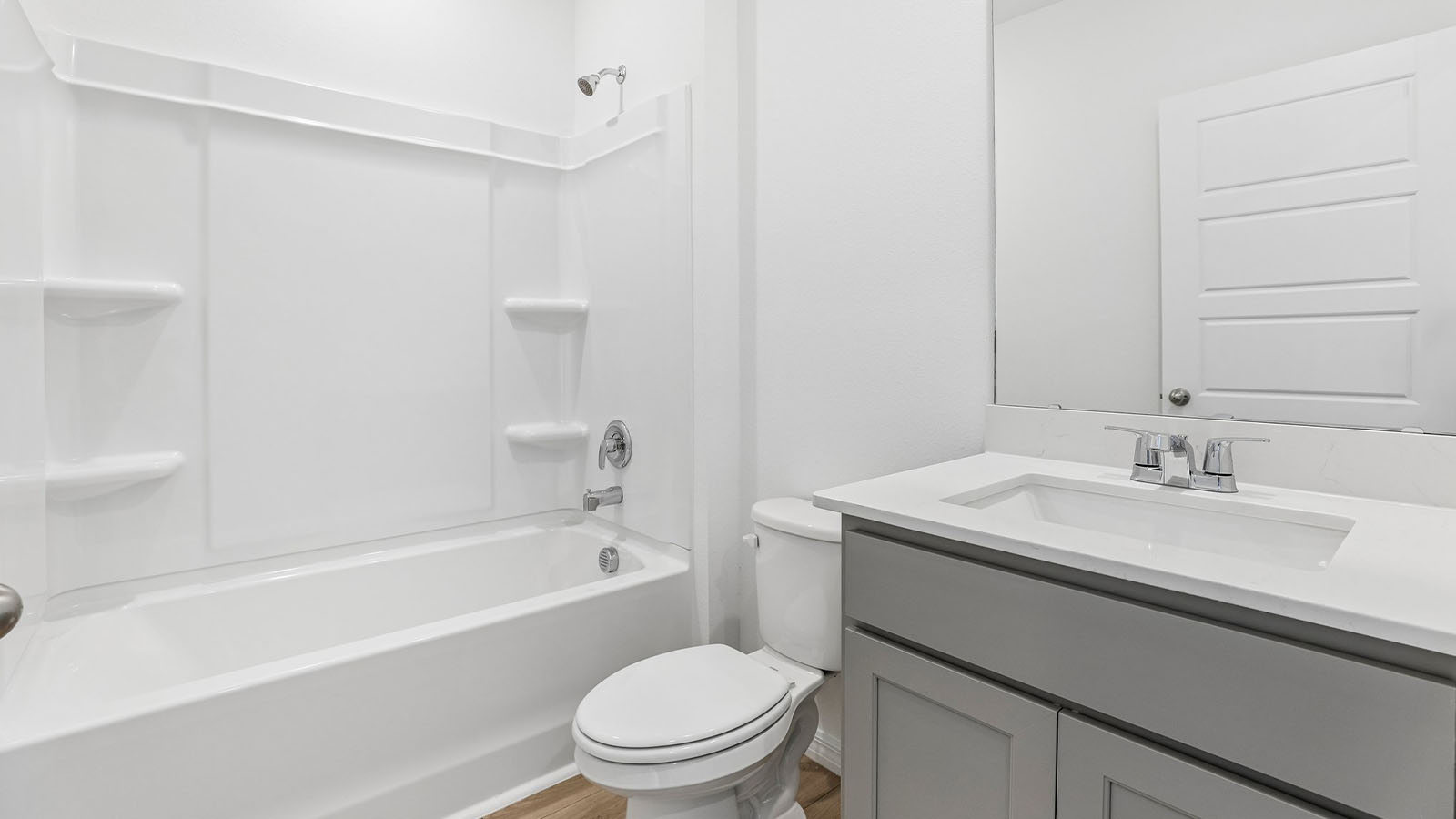 Guest bathroom with tub and single vanity