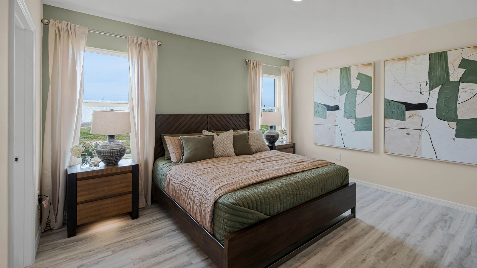 Primary bedroom with bed and nightstands
