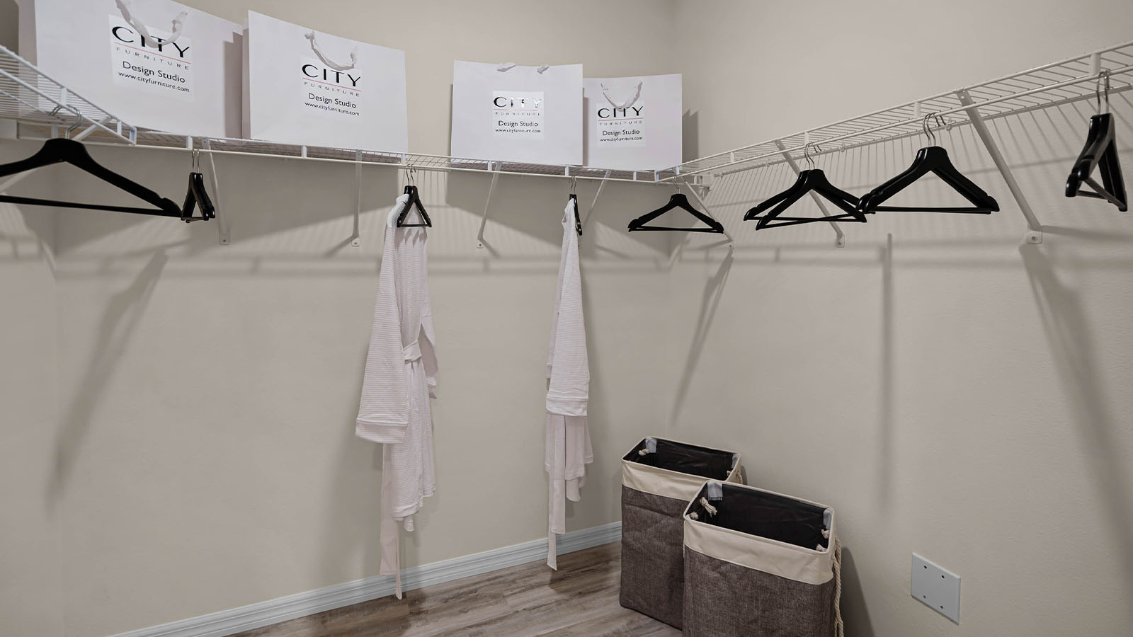 Primary walk in closet with built in shelves