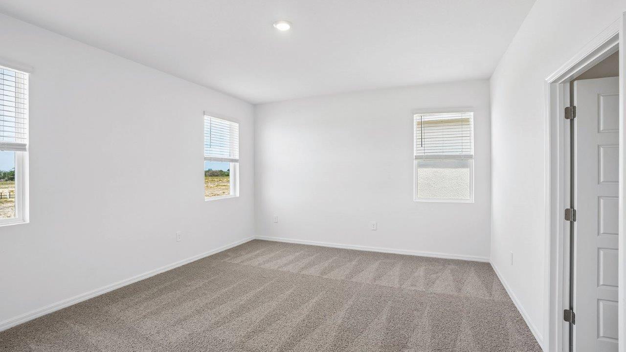 Primary bedroom with windows