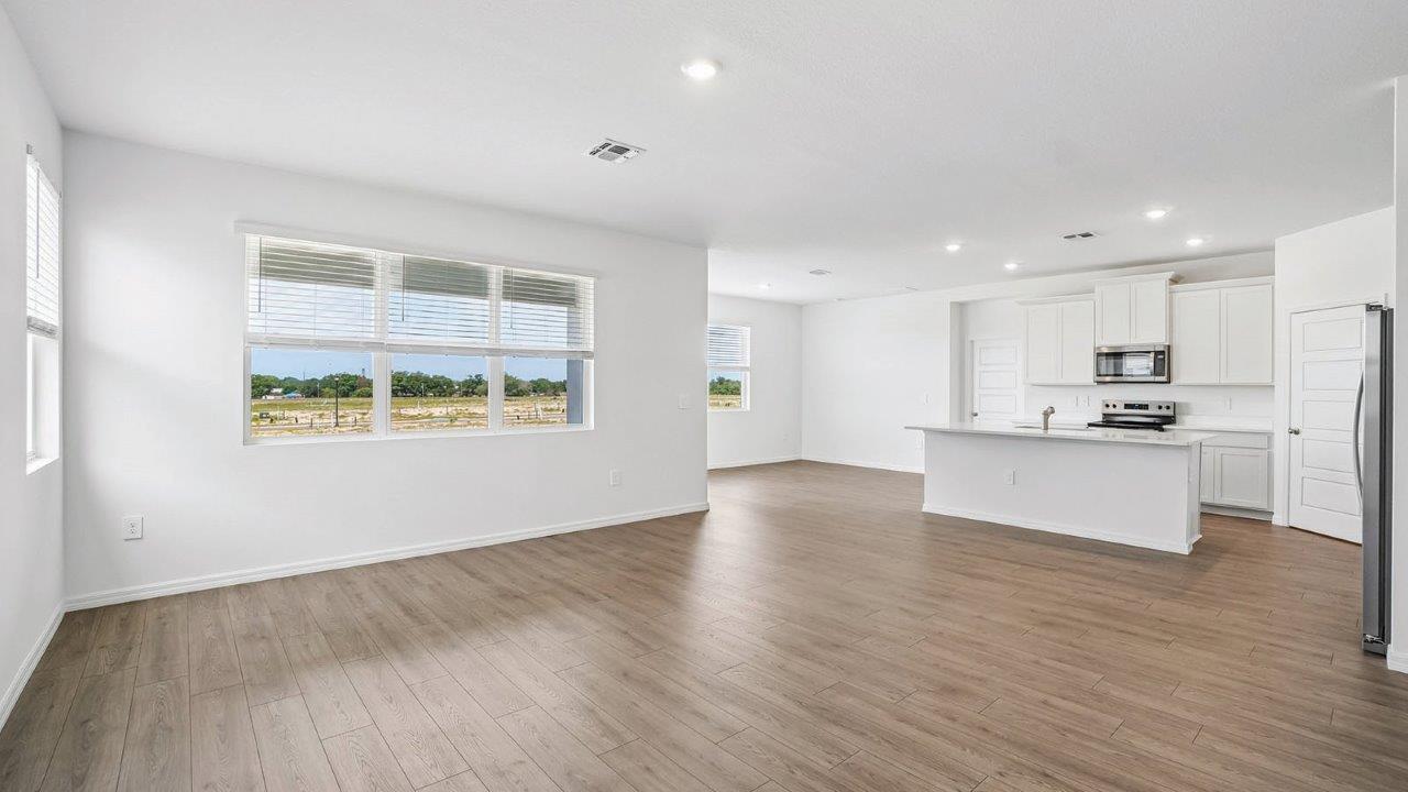 Living room with view of kitchen and dining area
