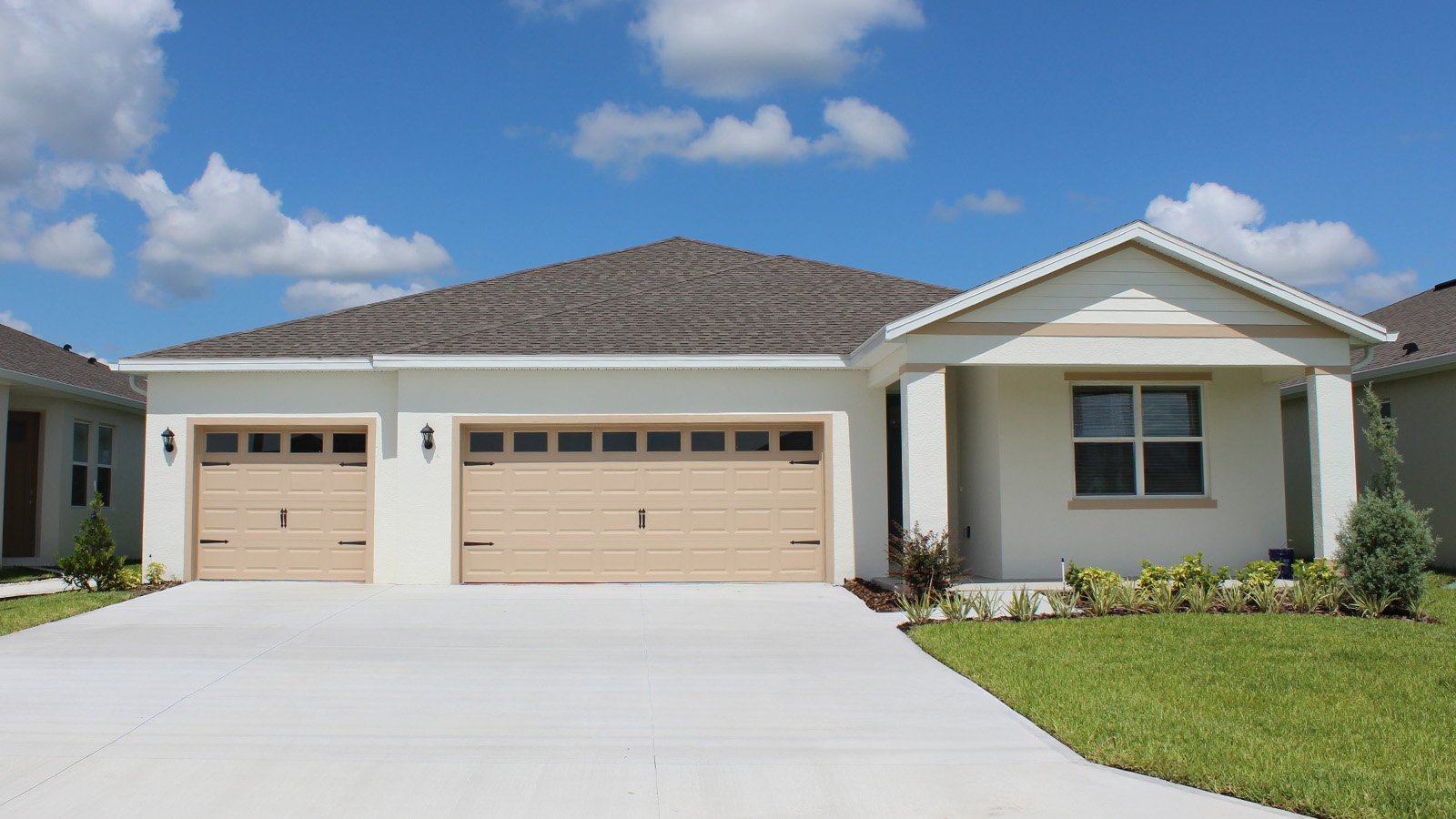 exterior single family home with 3 car garage