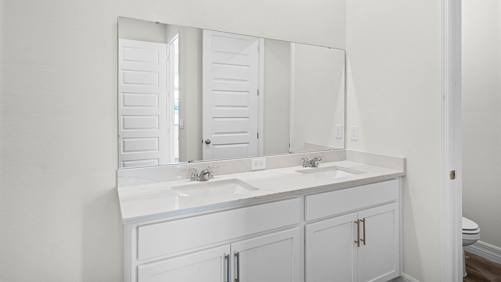 primary bathroom with double vanity sink