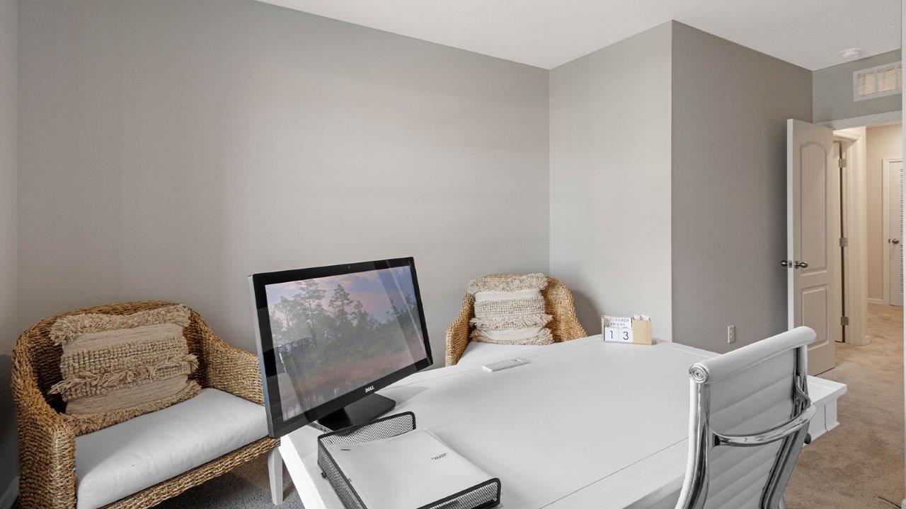 Office with desk and chairs