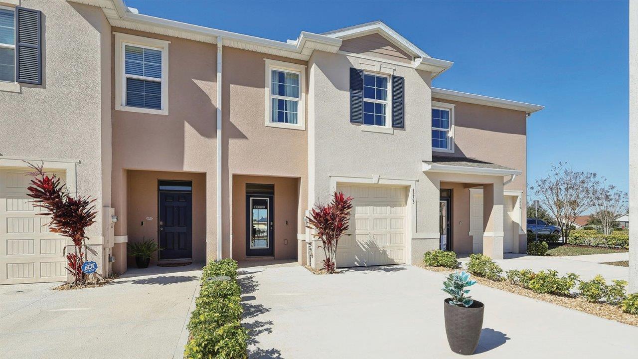 Exterior townhomes of glen model with beige color and two car driveways