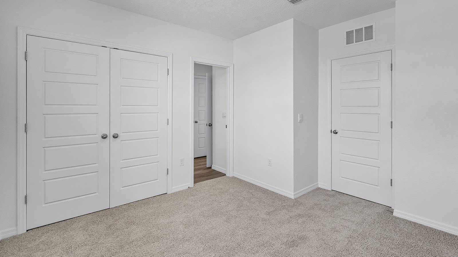 Guest bedroom with carpet