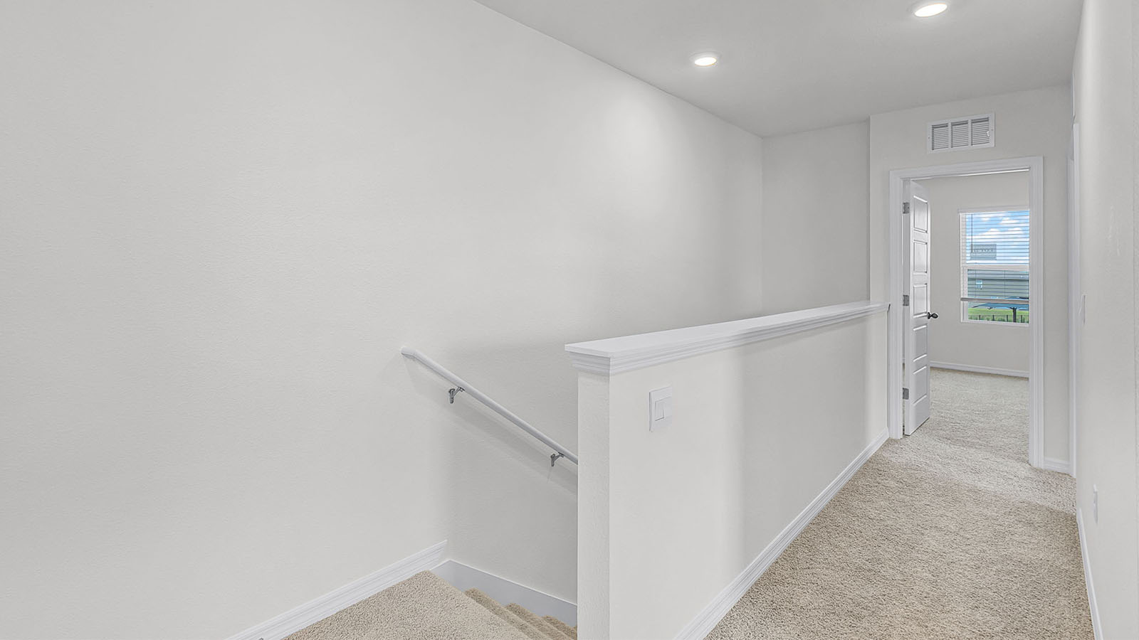 upstairs hallway with carpet