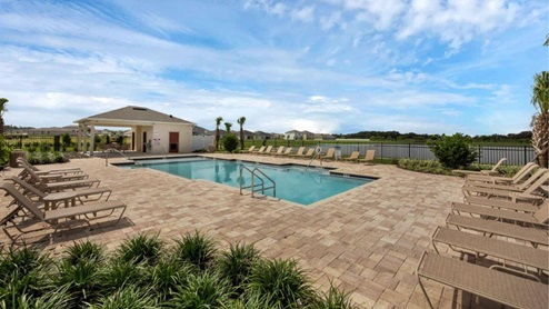 Lake side Pool amenity with covered patio