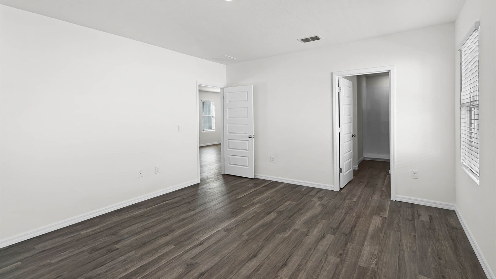 primary bedroom showing closet and entry door