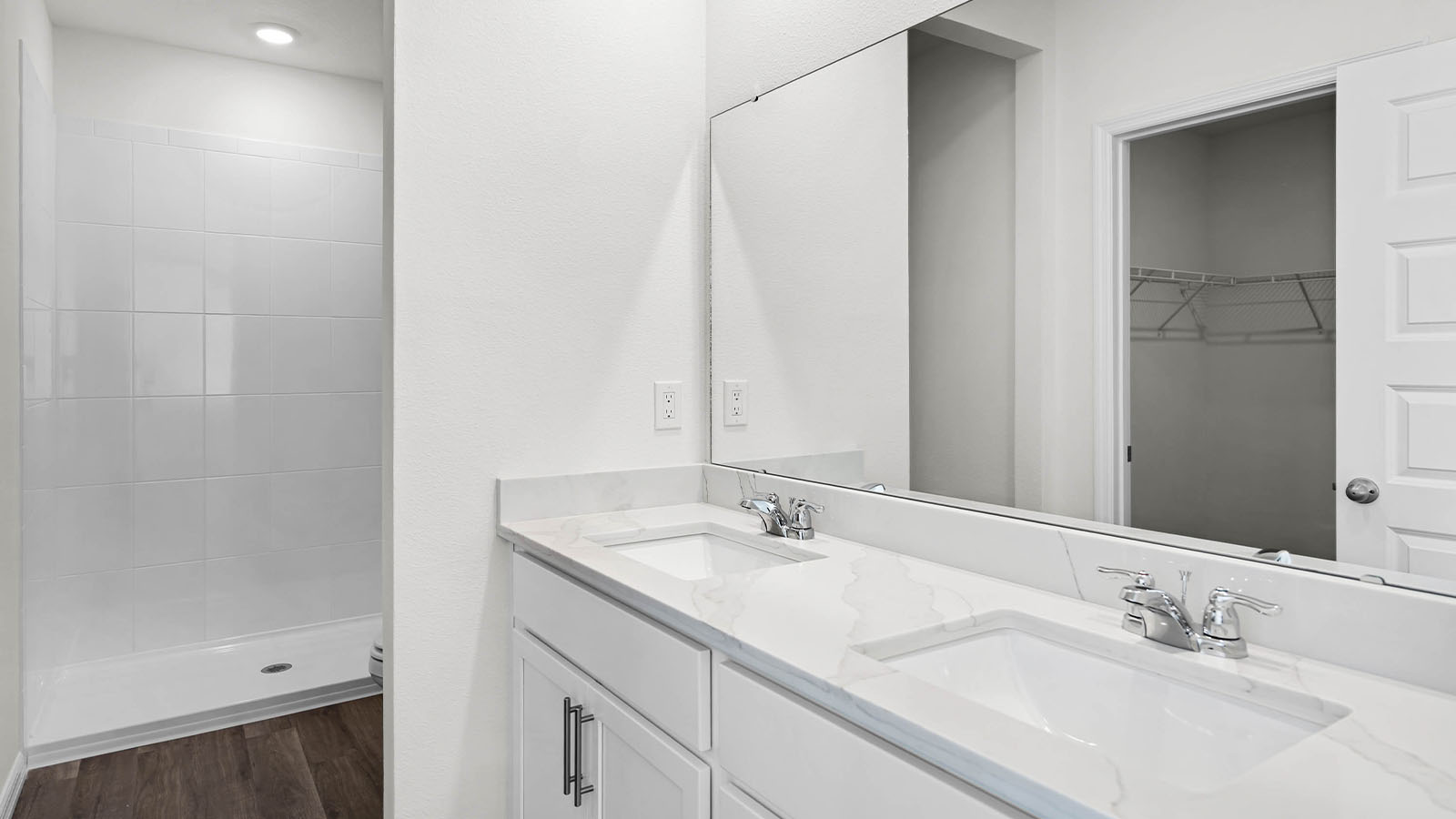 primary bathroom with dual vanity sink
