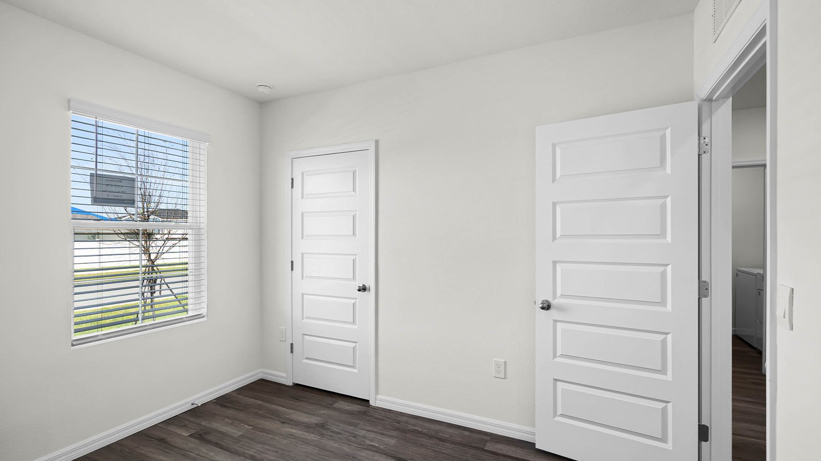 guest bedroom showing doors and window