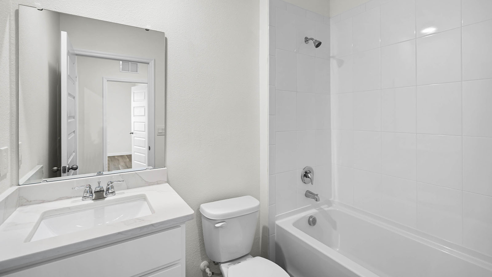 guest bathroom showing sink, toilet and tub