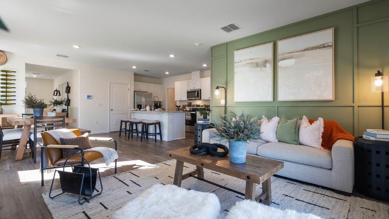 Open concept living room with views to the dining room and kitchen