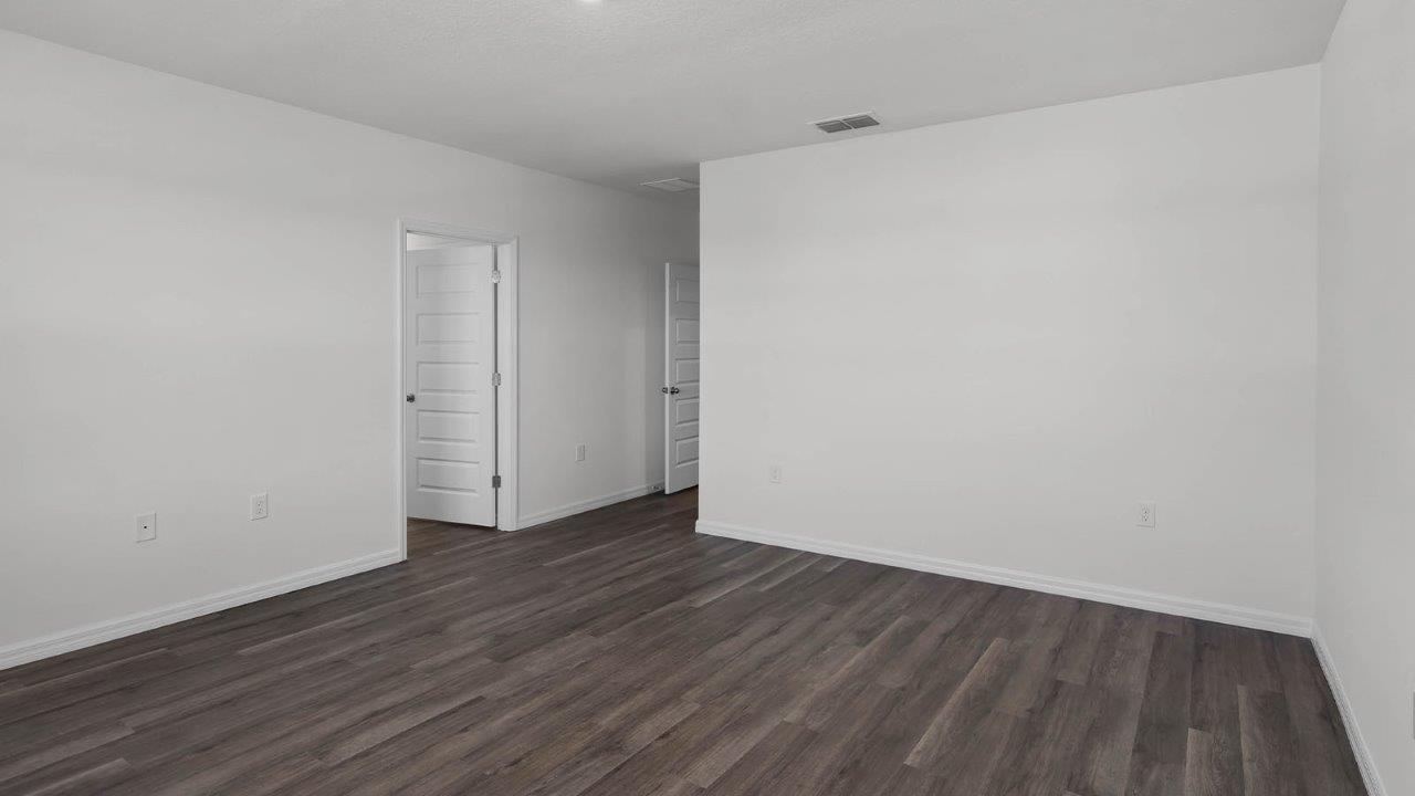 Primary Bedroom unfurnished with walk in closet