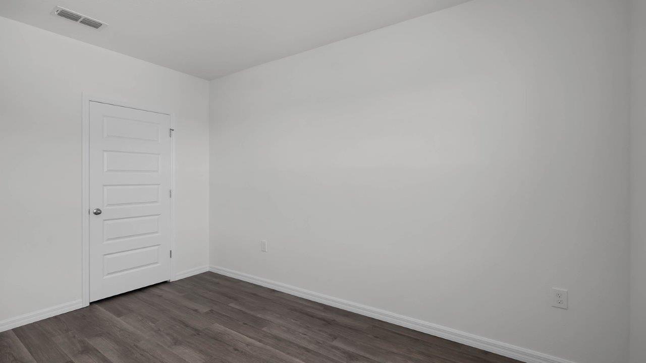 second guest bedroom unfurnished with closet