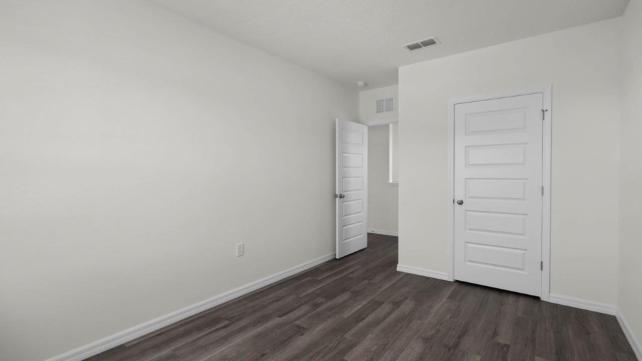 second guest bedroom unfurnished with closet