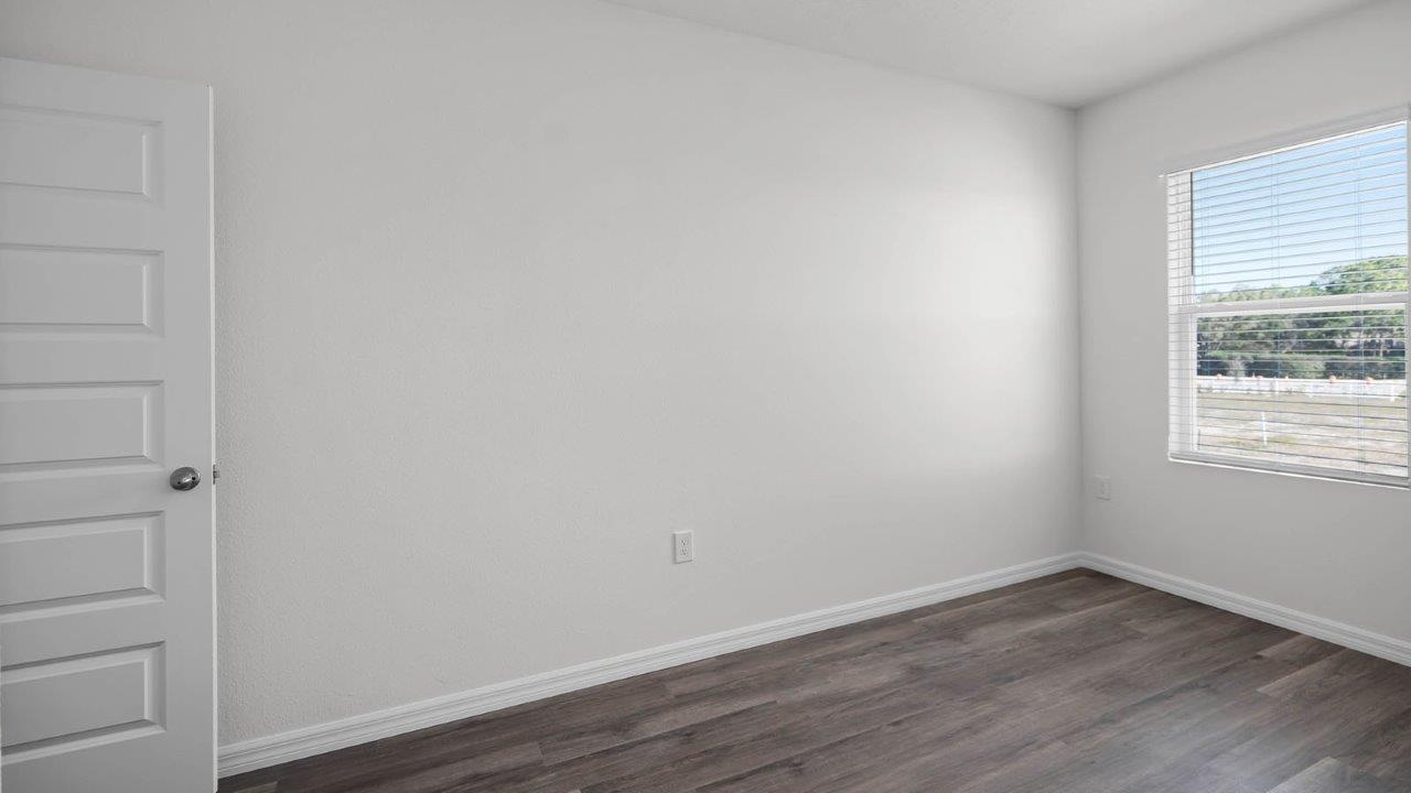 fourth guest bedroom unfurnished with window