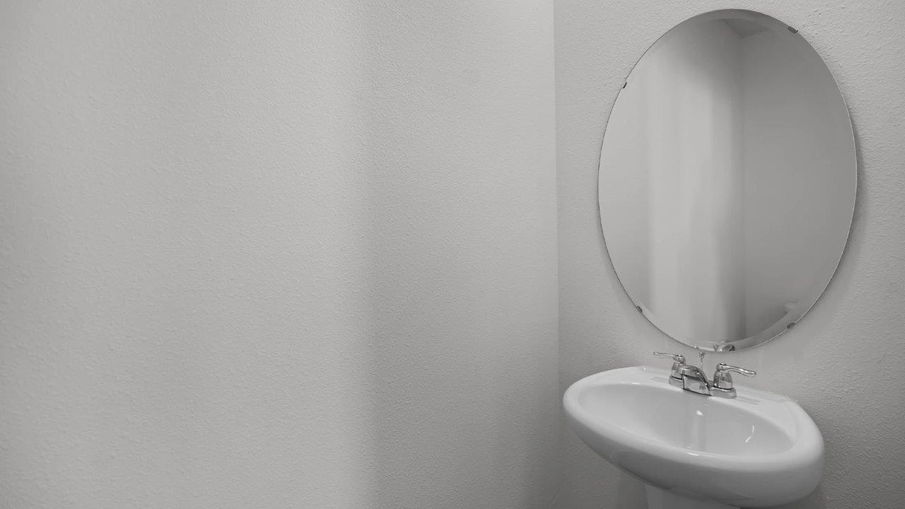 half bathroom with sink and toliet