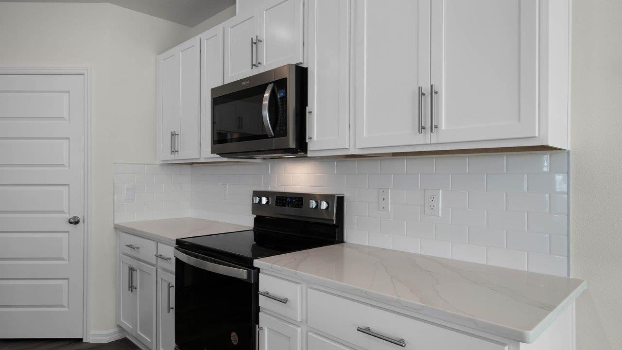 Close up of kitchen counters with stainless steel appliances