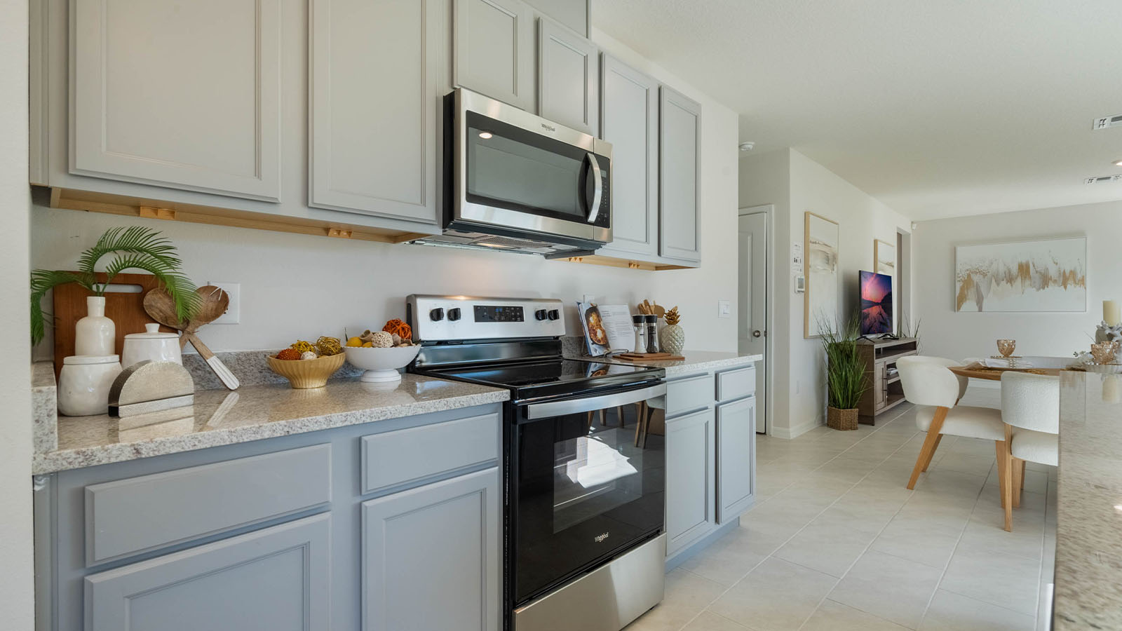 Kitchen with stainless steel appliances adjacent to the dining area