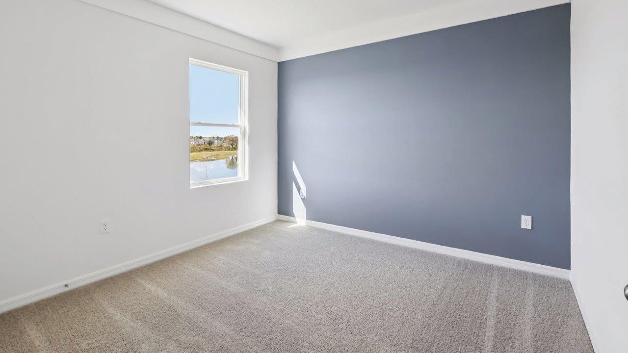 Upstairs guest bedroom with window
