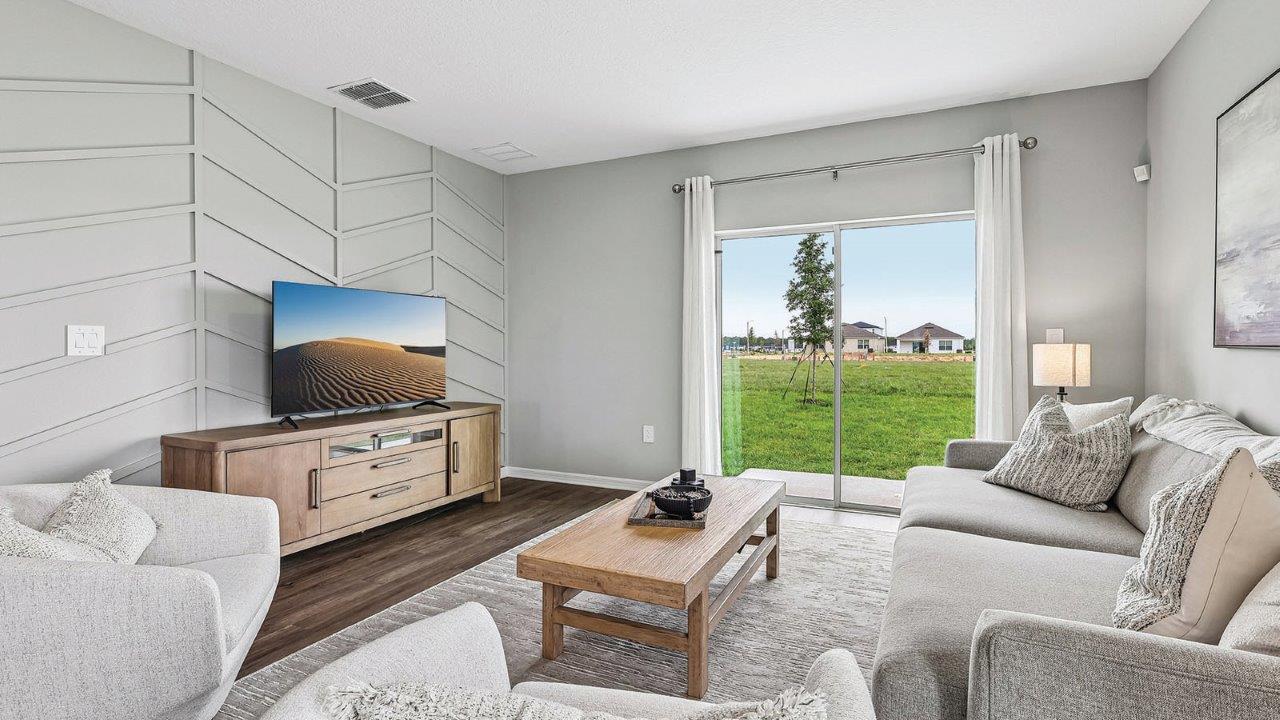 Living room with sliding doors to backyard