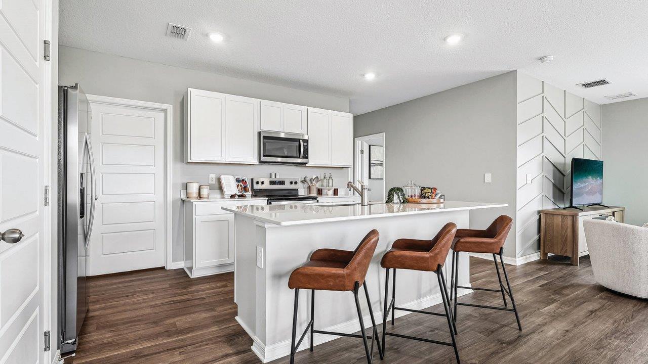 Kitchen with island and bar seating