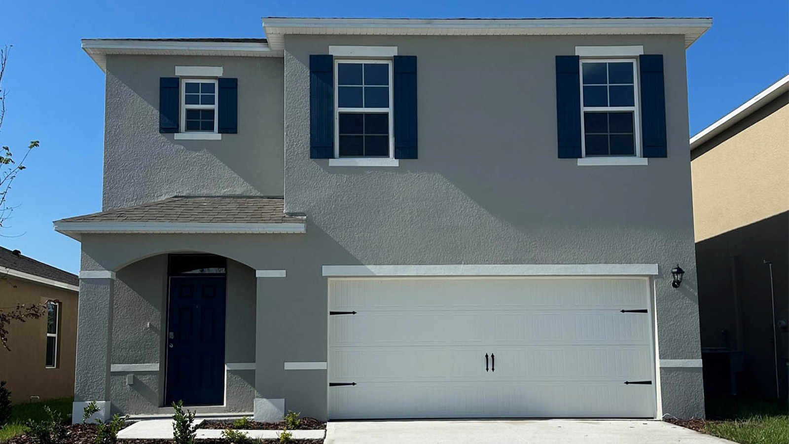 Exterior single family home with two car garage