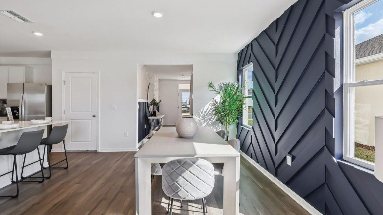Dining room with 6 person table and two windows
