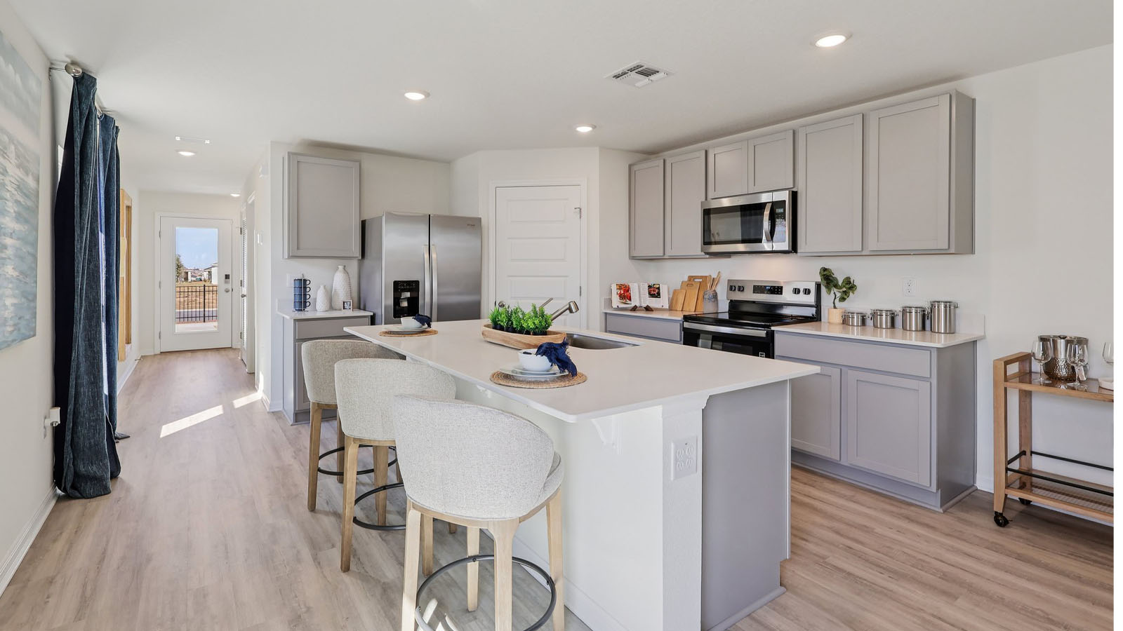 Kitchen with large island and grey cabinets