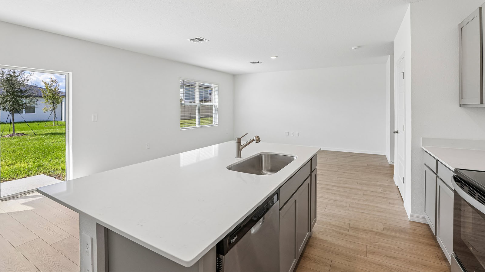 Kitchen looking to the dining area and living room