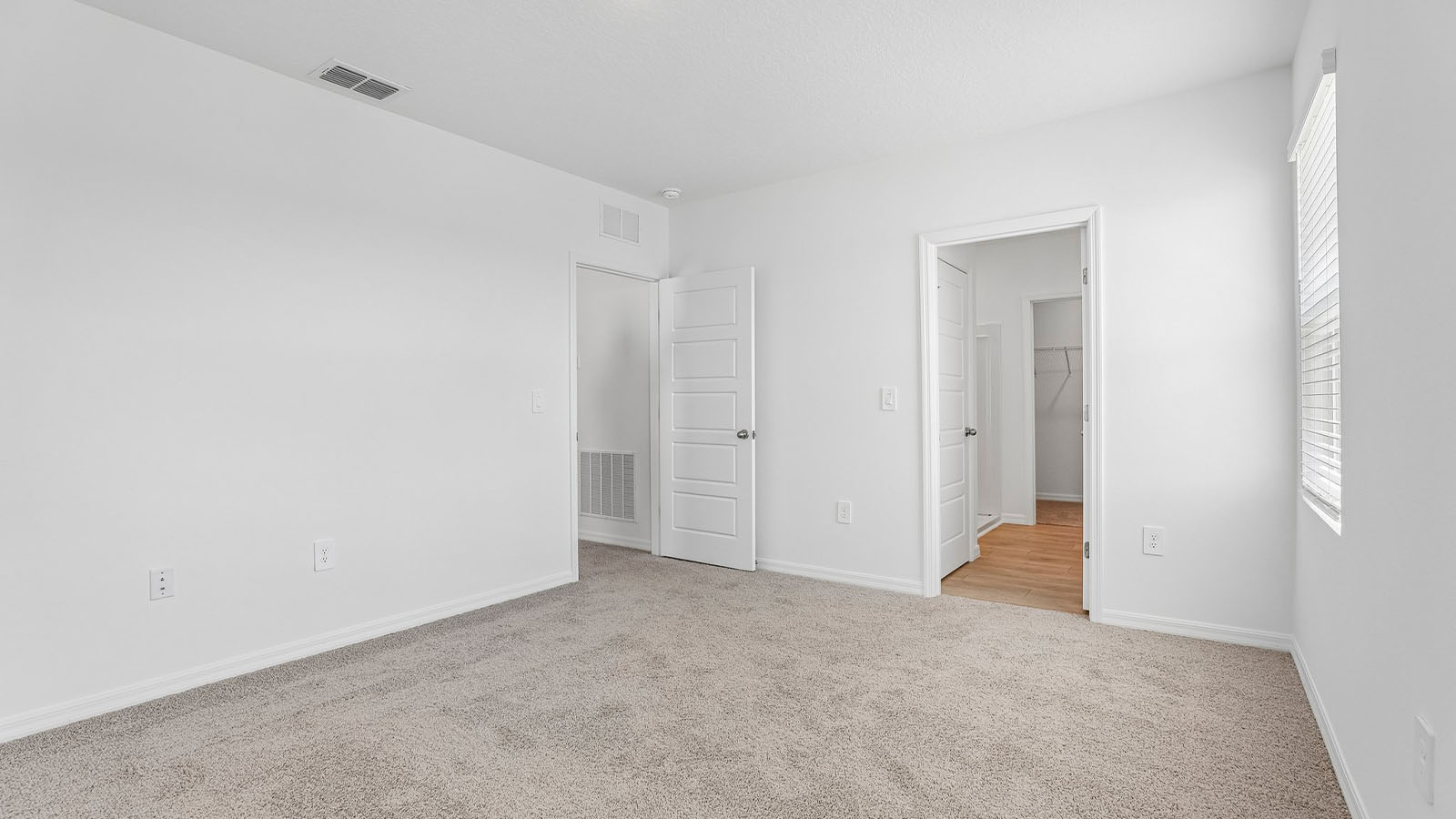 Primary bedroom with ensuite bathroom