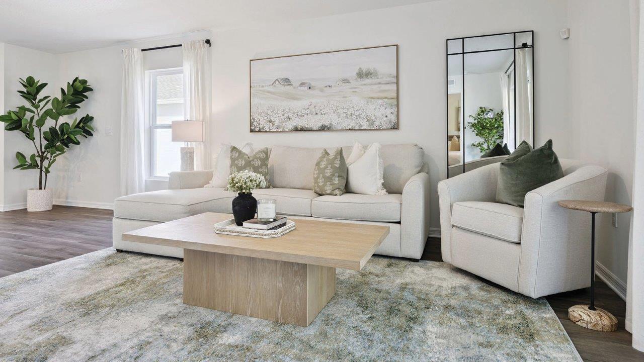 living room with coffee table, couch and chair