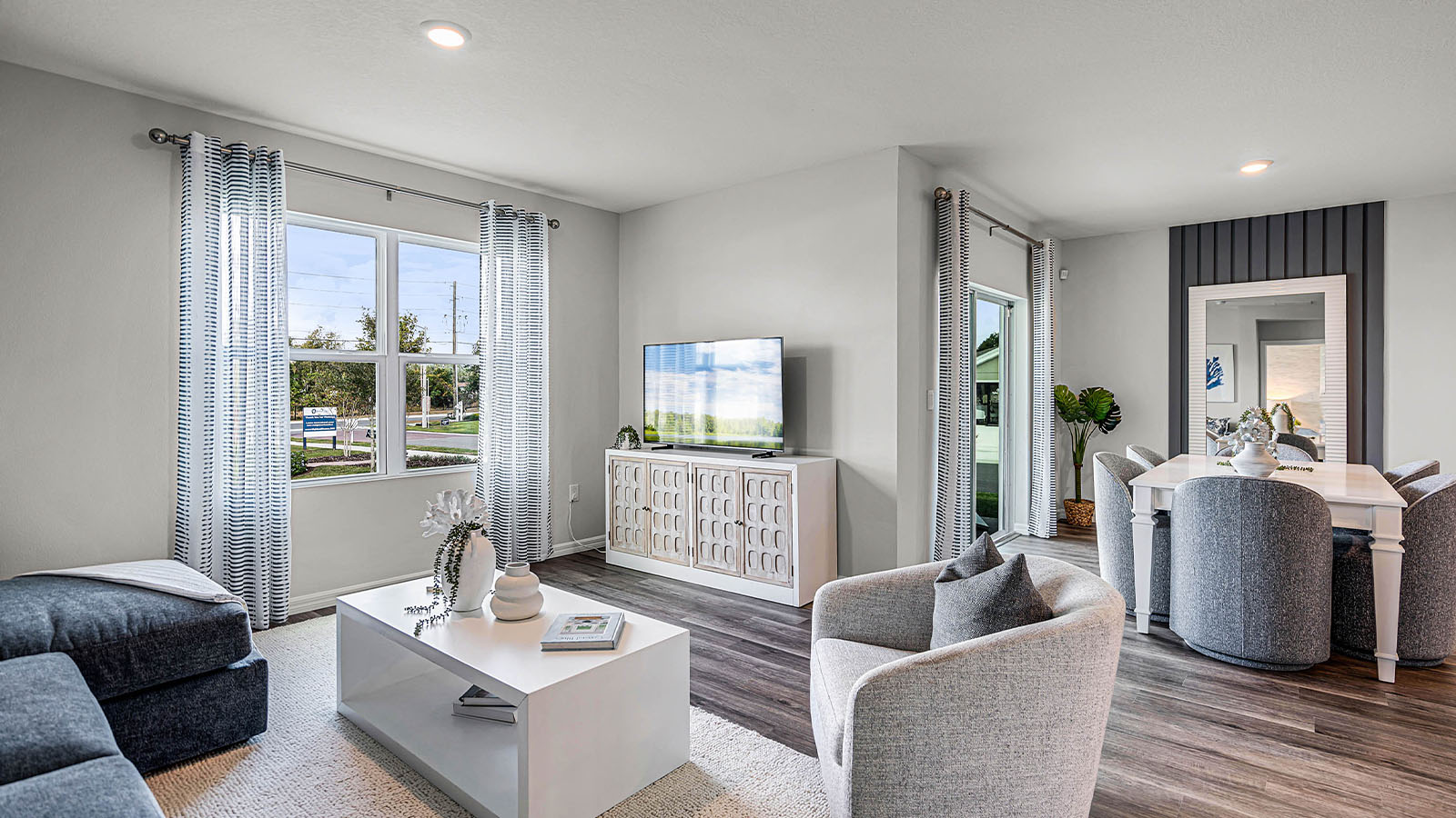 Living room with view to the kitchen and dining room