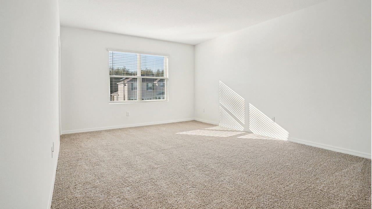 primary bedroom with carpet