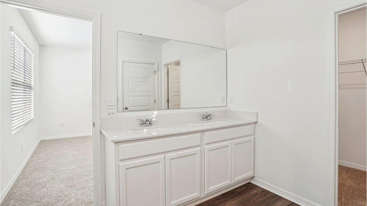 primary bathroom with double vanity sink