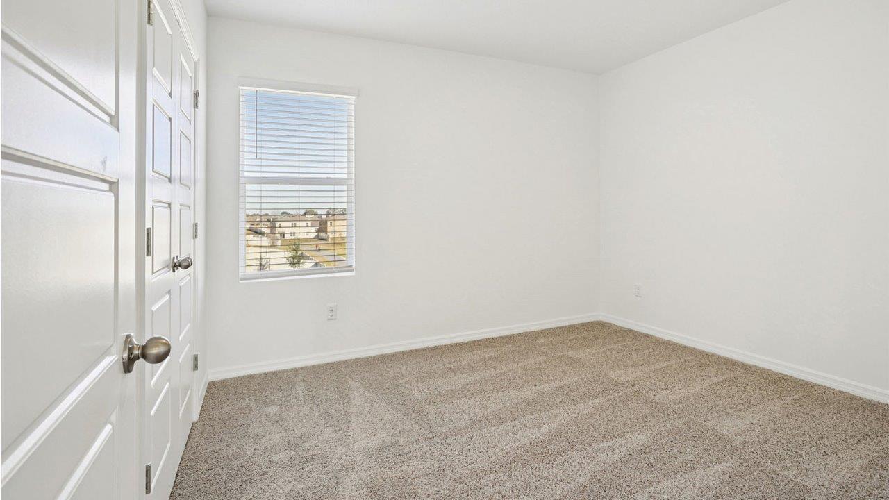 guest bedroom with carpet