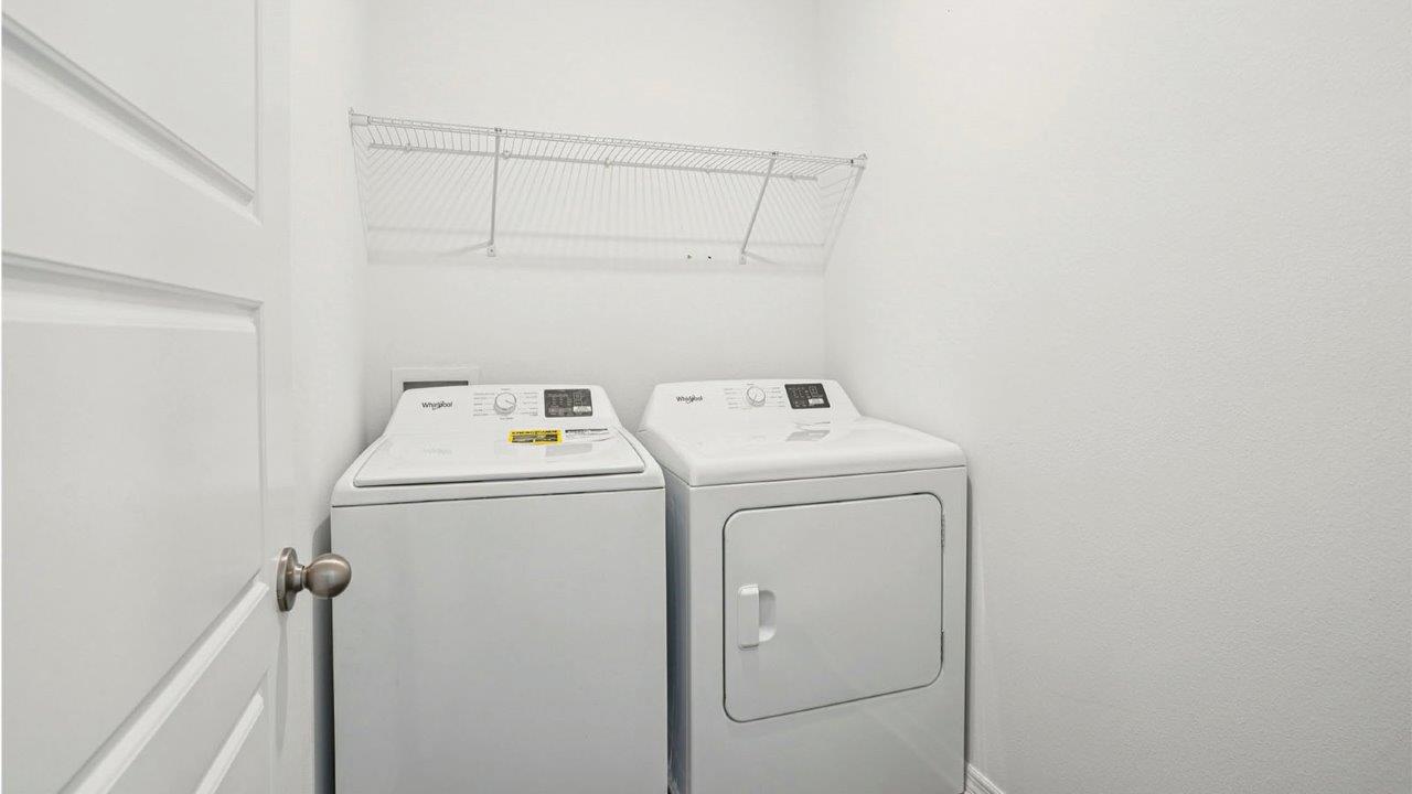 laundry room with washer and dryer