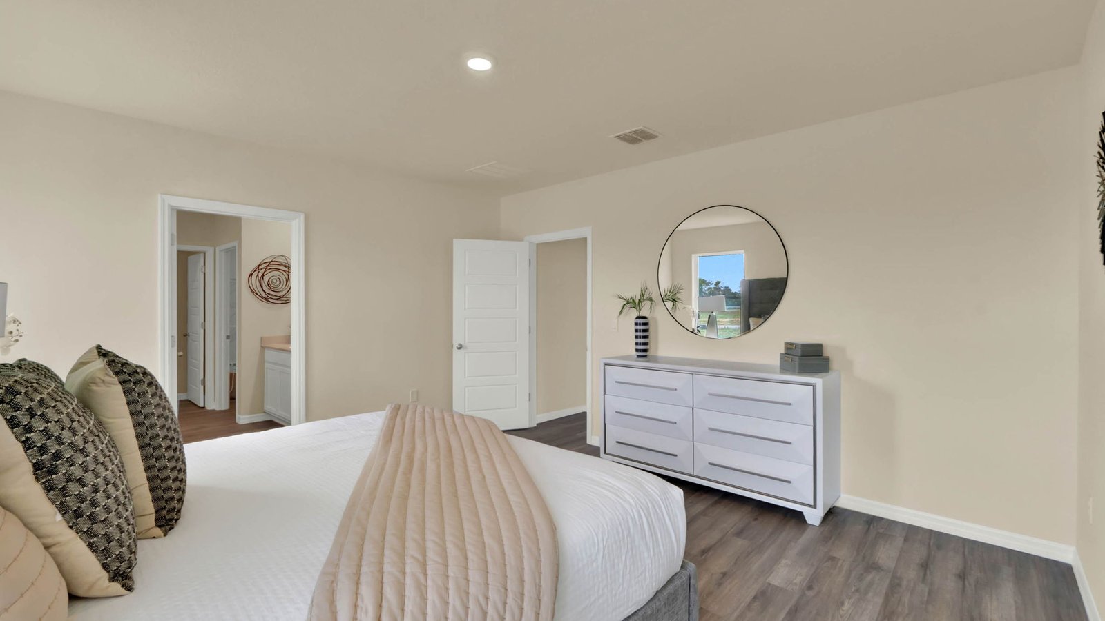 Primary bedroom with view of doors