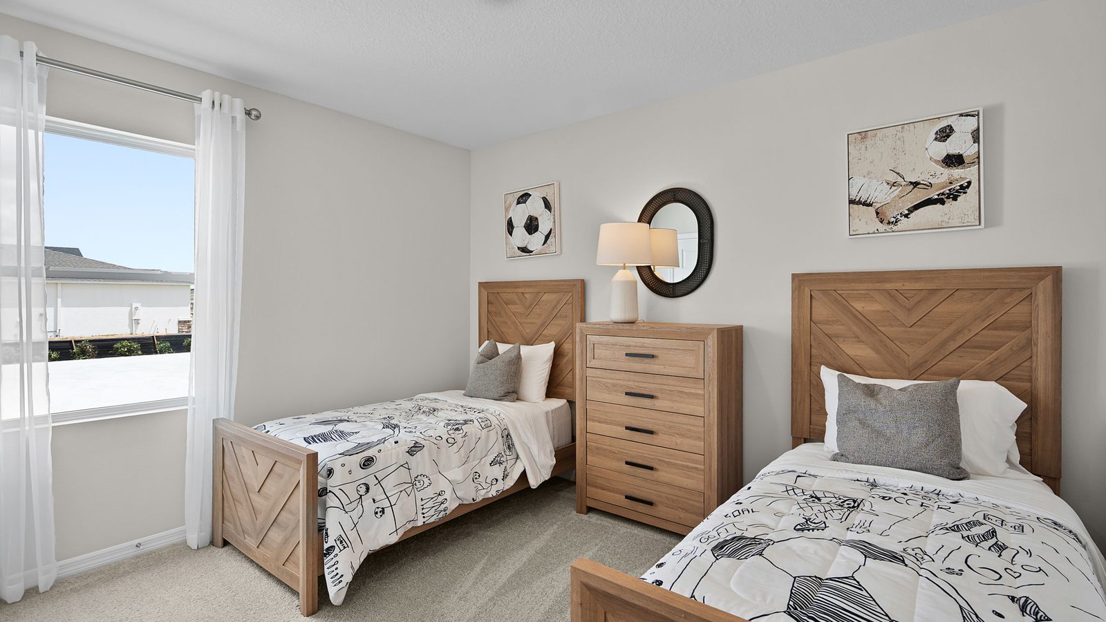 soccer themed bedroom with two twin sized beds