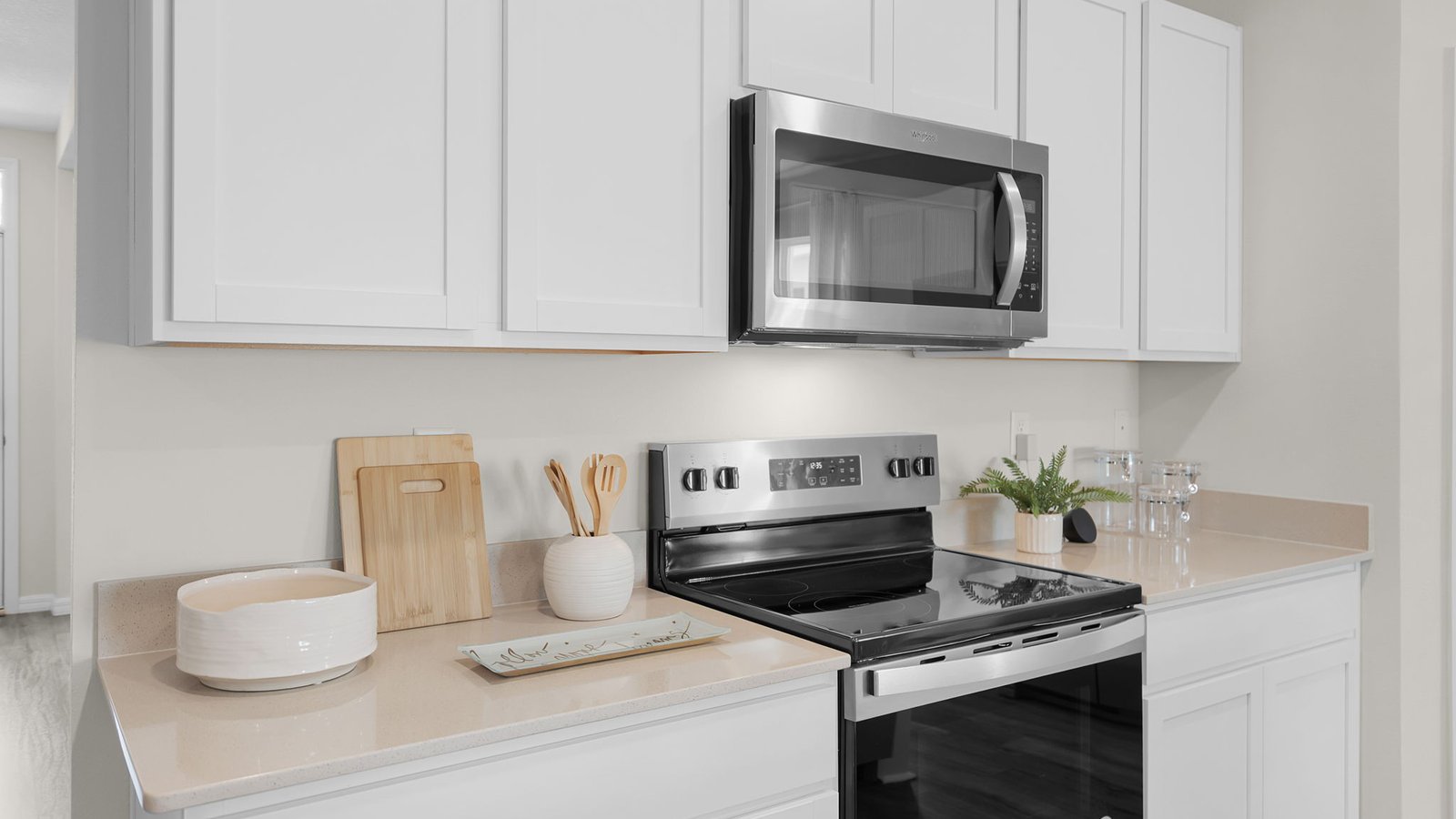 Kitchen showing the microwave and range