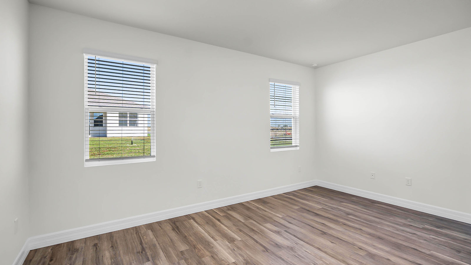 primary bedroom with door to primary bathroom