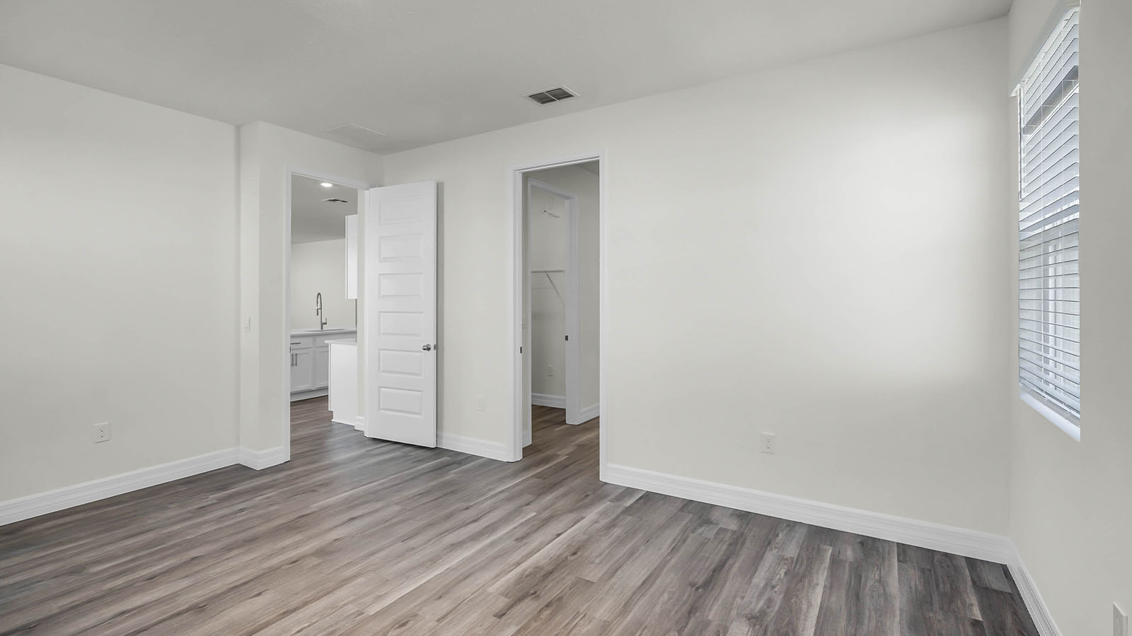 primary bedroom with walk in closet